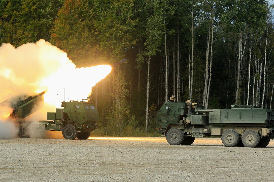 A military vehicle fires a rocket.
