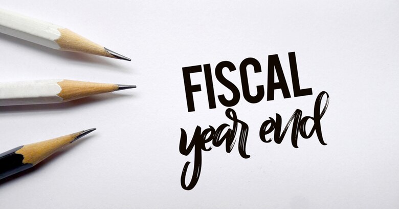 Photo of pencils pointing to the words end of fiscal year.