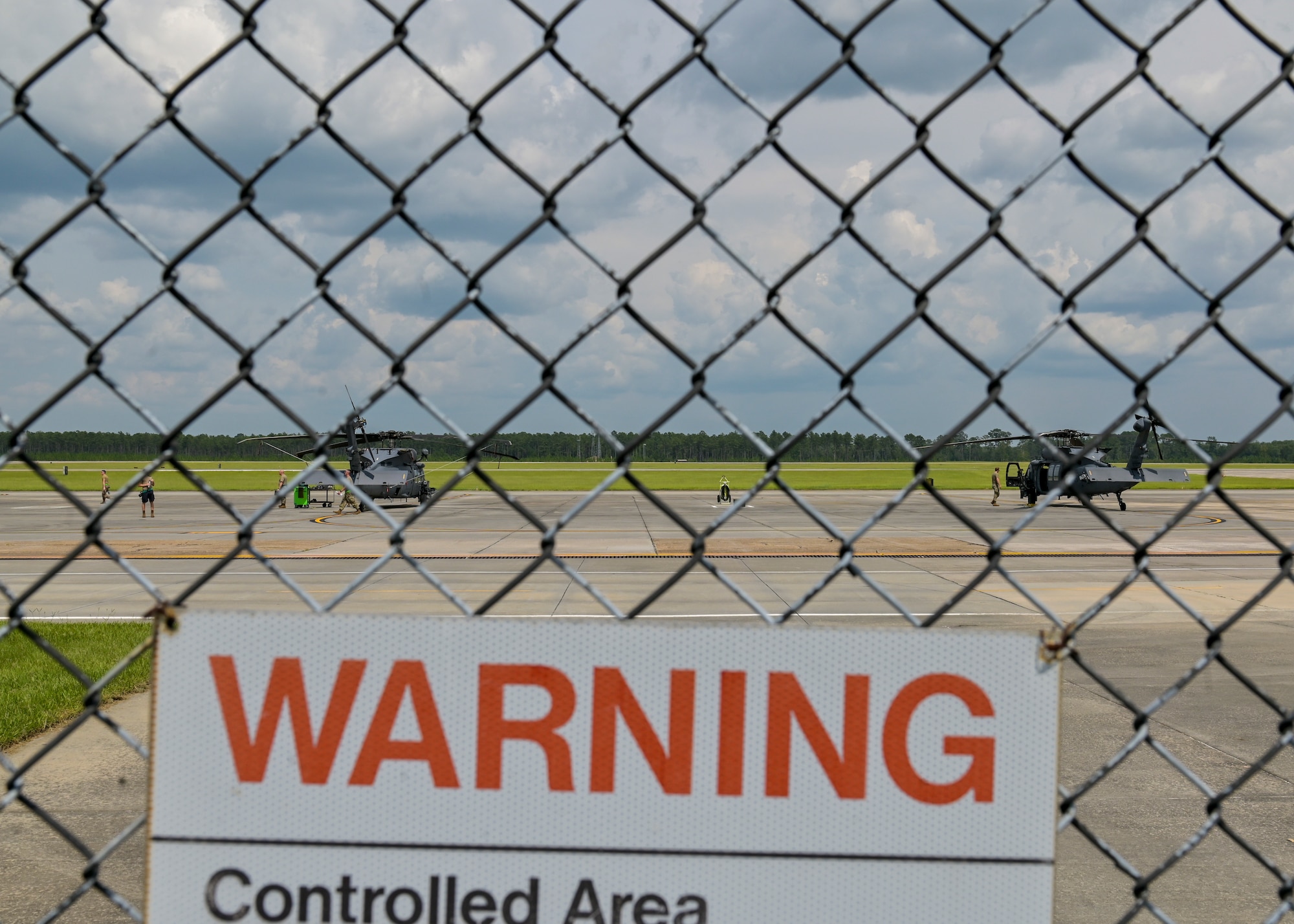 Two HH-60W Jolly Green II sit on the runway at Moody Air Force Base, Georgia, July 25, 2023. Moody AFB is home to a fleet of HH-60W’s, A-10C Thunderbolt II’s and HC-130 Combat King II’s. (U.S. Air Force photo by Airman 1st Class Leonid Soubbotine)
