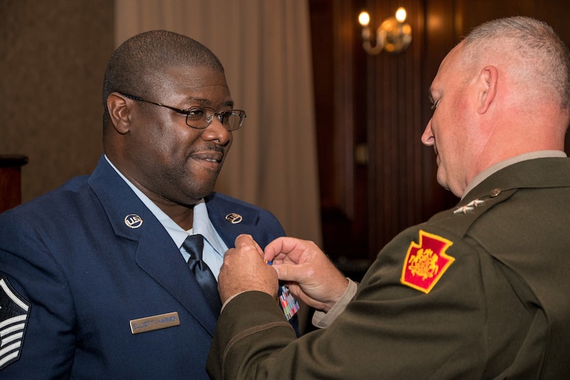 Master Sgt. Duke Elliott-Harmon of the 111th Attack Wing receives the prestigious Maj. Octavius V. Catto Medal at a ceremony Oct. 7 at the Union League of Philadelphia. (Pennsylvania National Guard photo by Staff Sgt. Wilfredo Acosta Jr.)