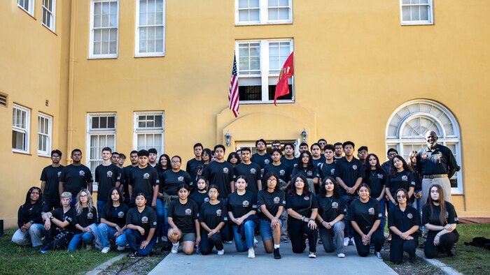 Students with Orange High School Marine Corps Junior Reserve Officers' Training Corps pose for a photo during a visit to the Command Museum at Marine Corps Recruit Depot San Diego, Oct. 6, 2023. Guided by Marine Corps customs and traditions, Orange High School’s MCJROTC visited MCRD San Diego, showcasing empowerment, critical thinking, and effective communication through activities like observing a Marine Corps Boot Camp graduation, touring the MCRDSD Museum, and participating in a drill instructor question and answers session. (U.S. Marine Corps photo by Sgt. Yvonna Guyette)