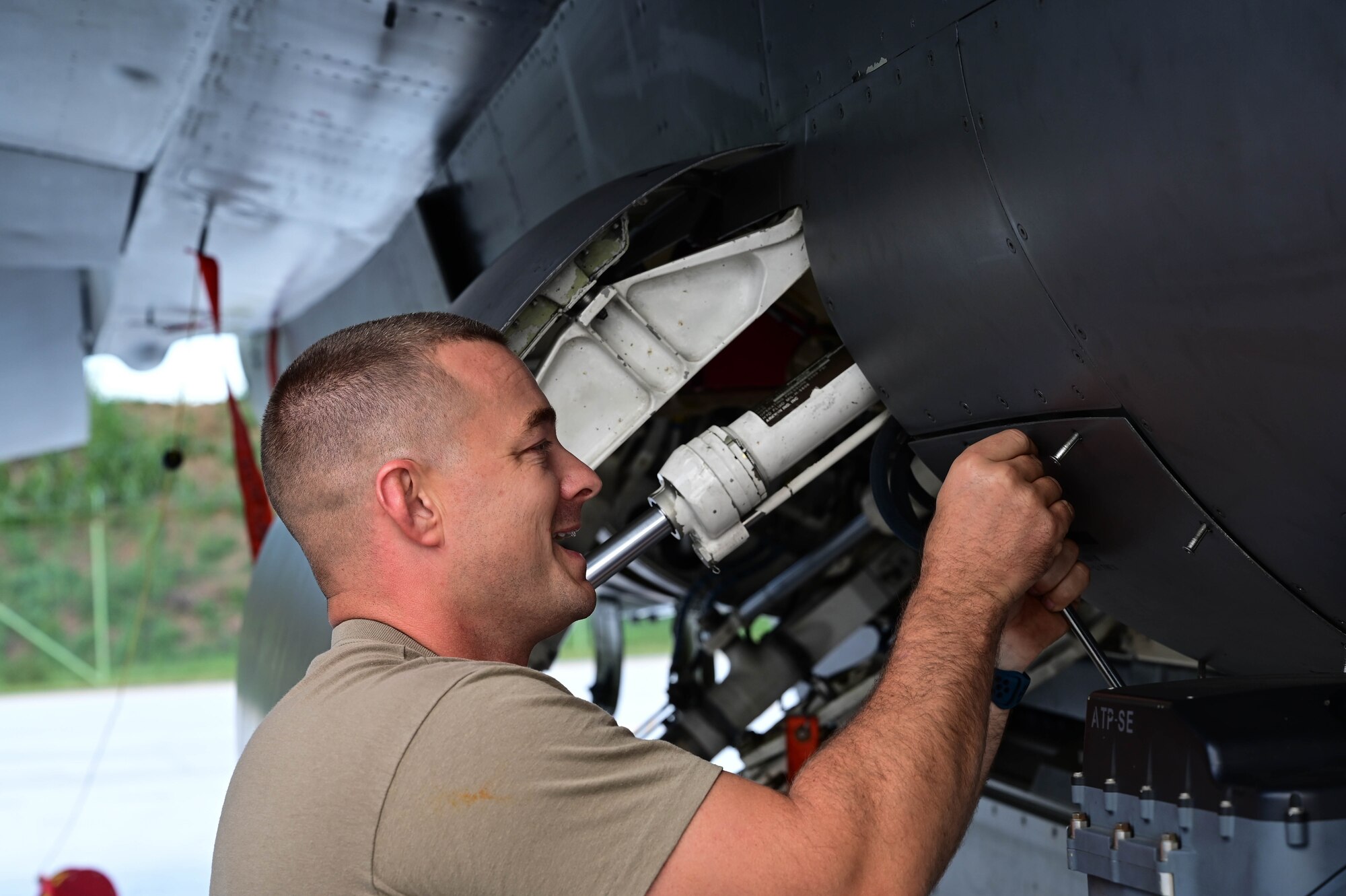 U.S. Air Force Master Sgt. Ken Washausen, 510th Fighter Generation Squadron productions superintendent, services an F-16 Fighting Falcon liquid oxygen tank during Exercise Purple Reign.