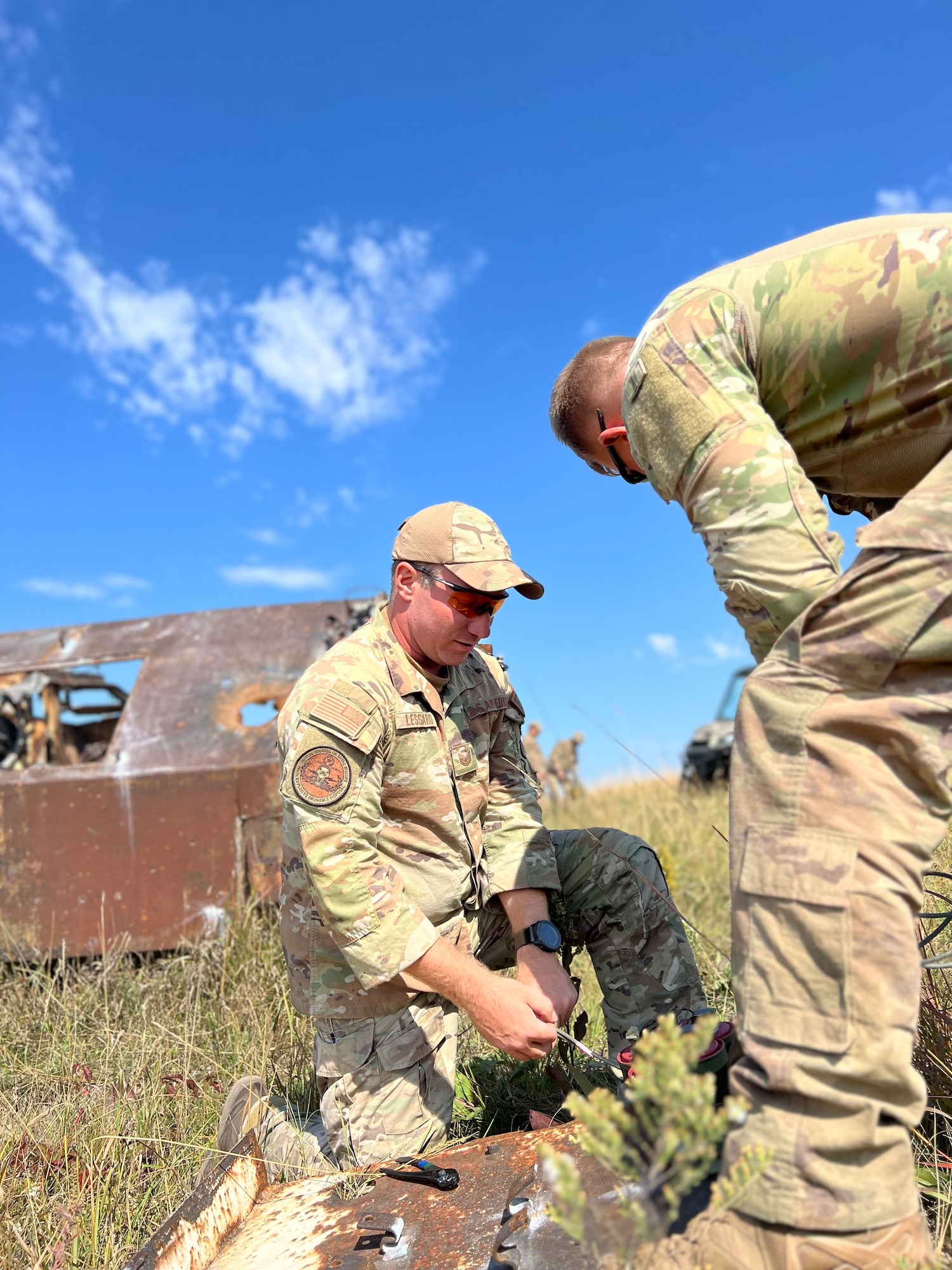 Explosive Ordnance Disposal technicians from across the Air National Guard, Air Force, Air Force Reserve, Navy and Wisconsin National Guard state partners from Papua New Guinea test explosive effects during demolition training as part of an Advanced EOD Conventional Course at Camp Ripley Training Center, Minnesota National Guard on September 20, 2023. The Advanced EOD Conventional Course provides experience, validation, and confidence in using complex EOD tools and procedures. (U.S. Air National Guard photo by Audra Flanagan)