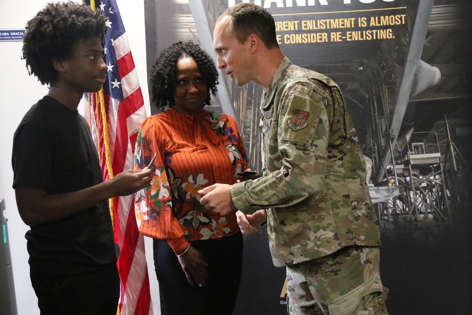 Tobye McMillian and her son, Emmanuel McClain, take the oath of enlistment into the Virginia Air National Guard from Col. Brock Lange, commander of the Virginia ANG’s 192nd Wing, Sept. 18, 2023, at Joint Base Langley-Eustis in Hampton, Virginia. McMillian, who is rejoining the military after an 18-year break in service, will serve in the Virginia Beach-based 203rd Rapid Engineer Deployable Heavy Operational Repair Squadron Engineers, or RED HORSE. After completing Air Force Basic Military Training and technical school, McClain will serve with the Langley-based 192nd Maintenance Group.