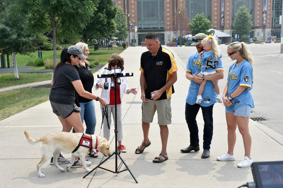 Jay Wilson, a retired lieutenant colonel with the Wisconsin Army National Guard, was presented with a service dog named Frosty July 24 at American Family Field™ in Milwaukee