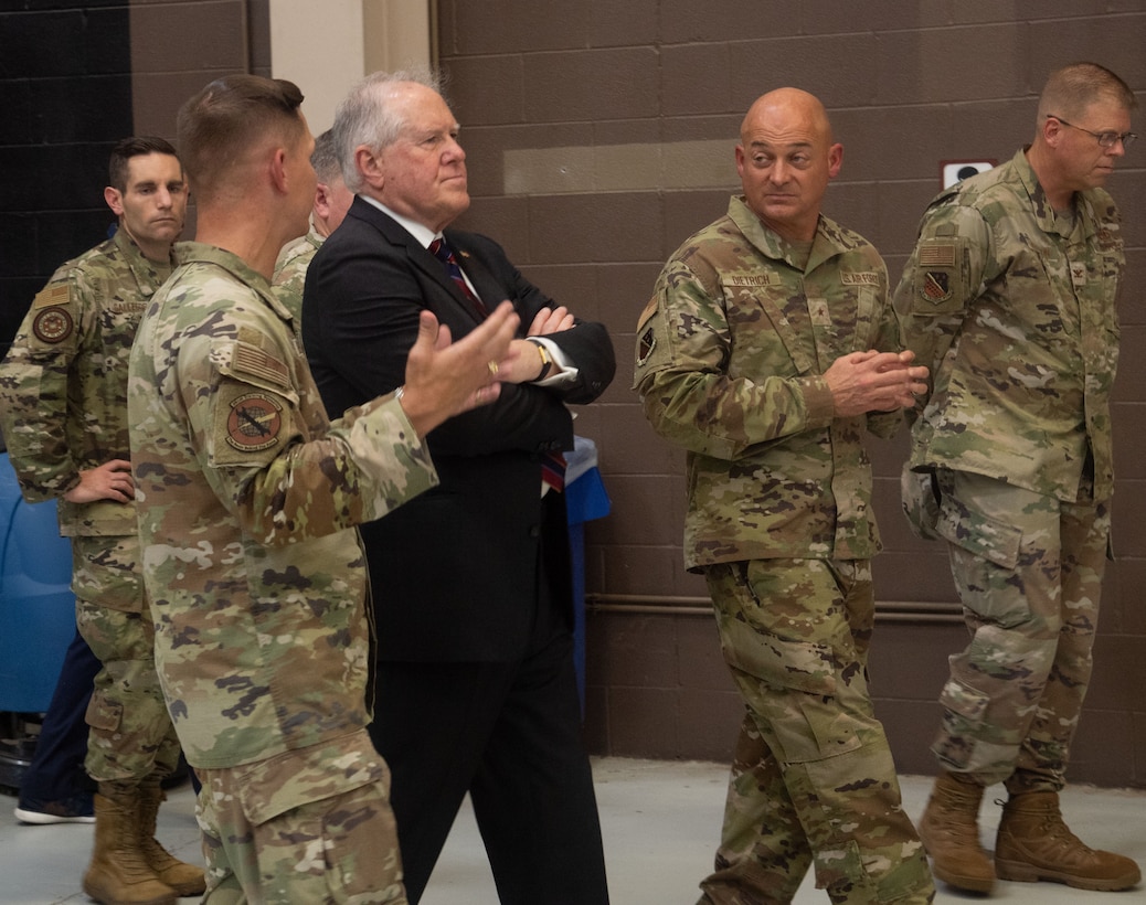 SECAF walks with members of the 361st TRS to tour the schoolhouse.