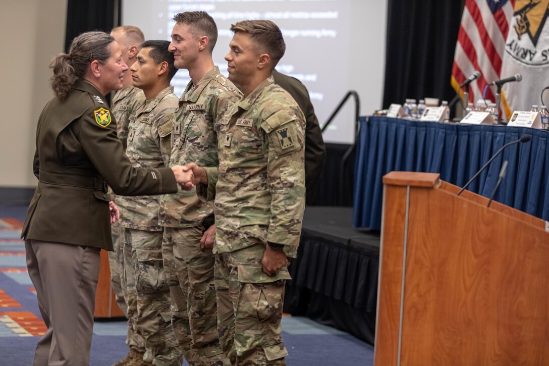 Lt. Gen. Jody Daniels shakes hands with Spc. Vincent Wentorf