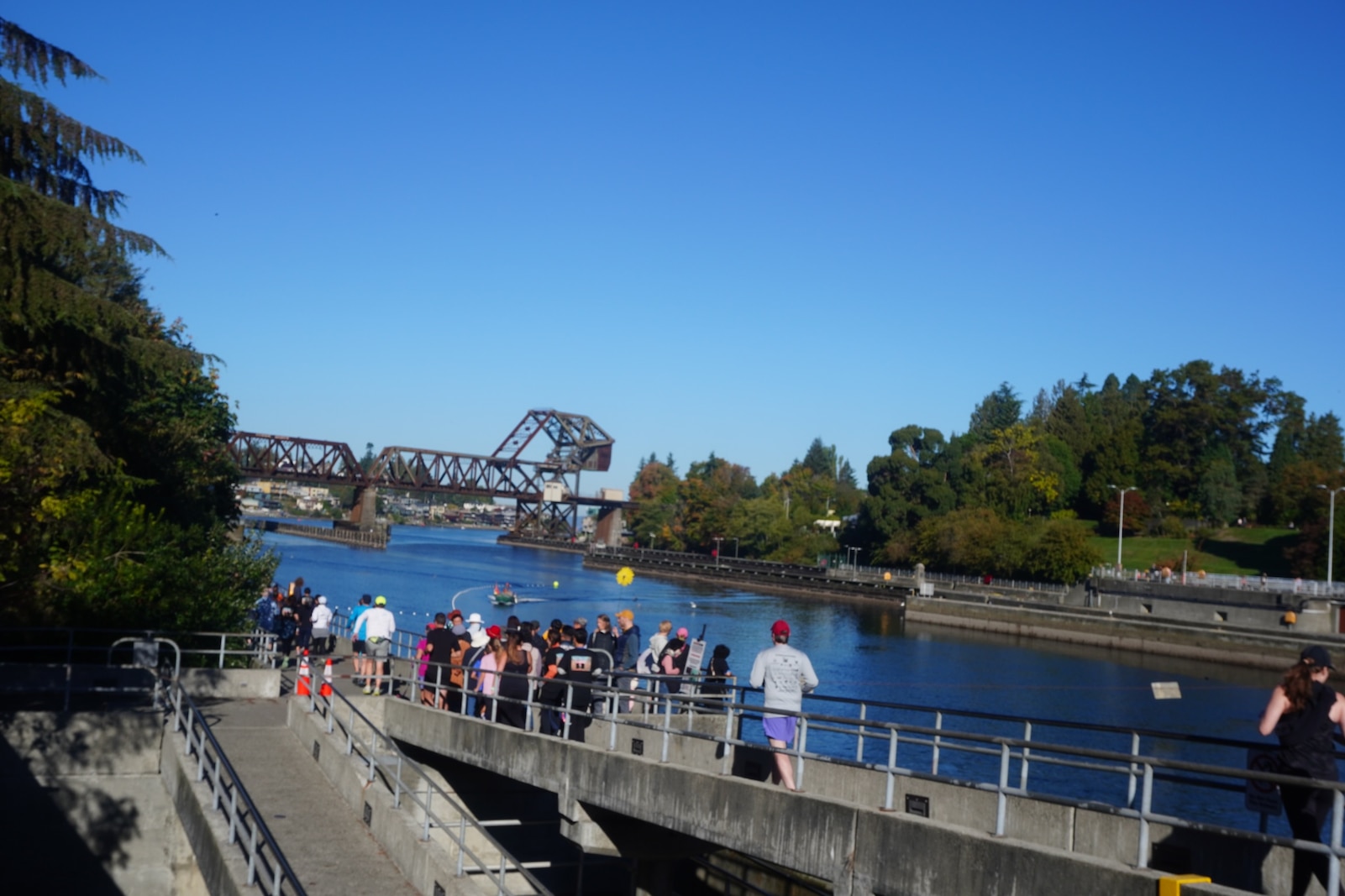 Participants run and walk along the grounds of Lake Washington Ship Canal and Hiram M. Chittenden Locks, Seattle, Washington, during the Great Miter Retire Fun Run, Oct. 7, 2023.