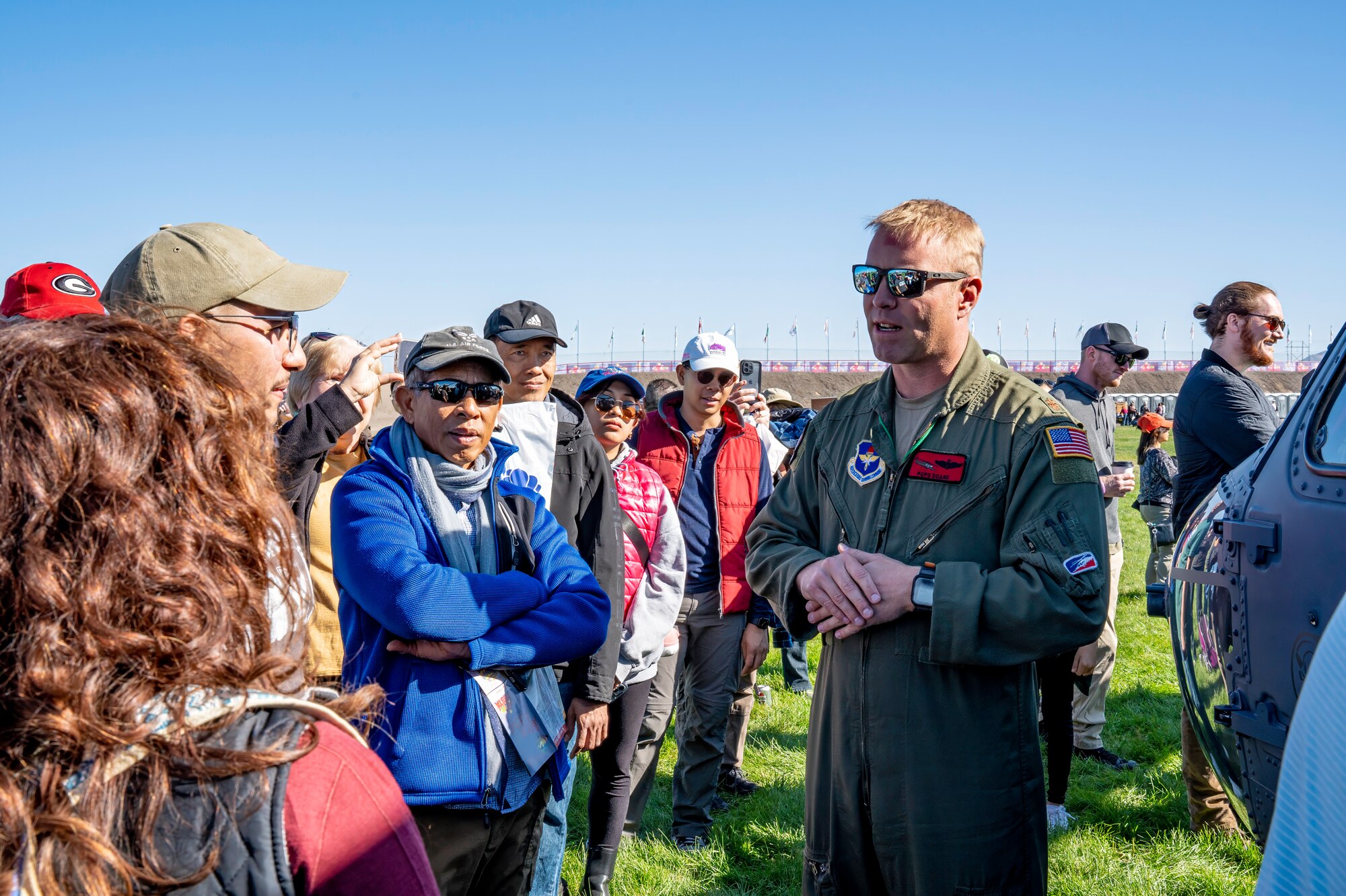 Helicopter pilot talks to visitors of the International Balloon Fiesta.