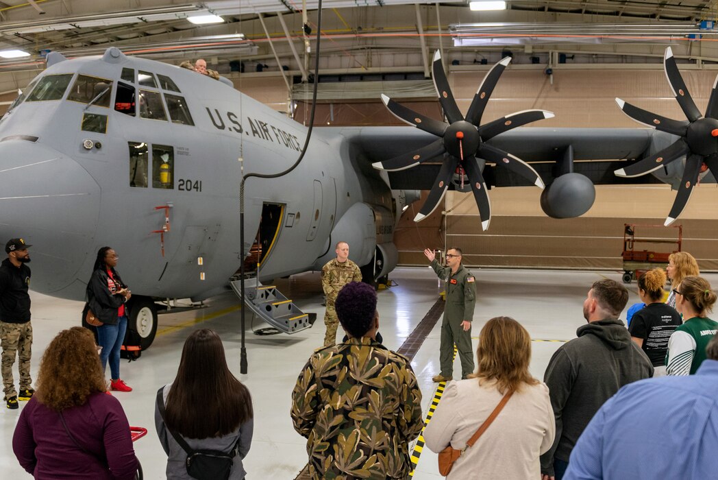 Civilians learn about military operations during a tour.