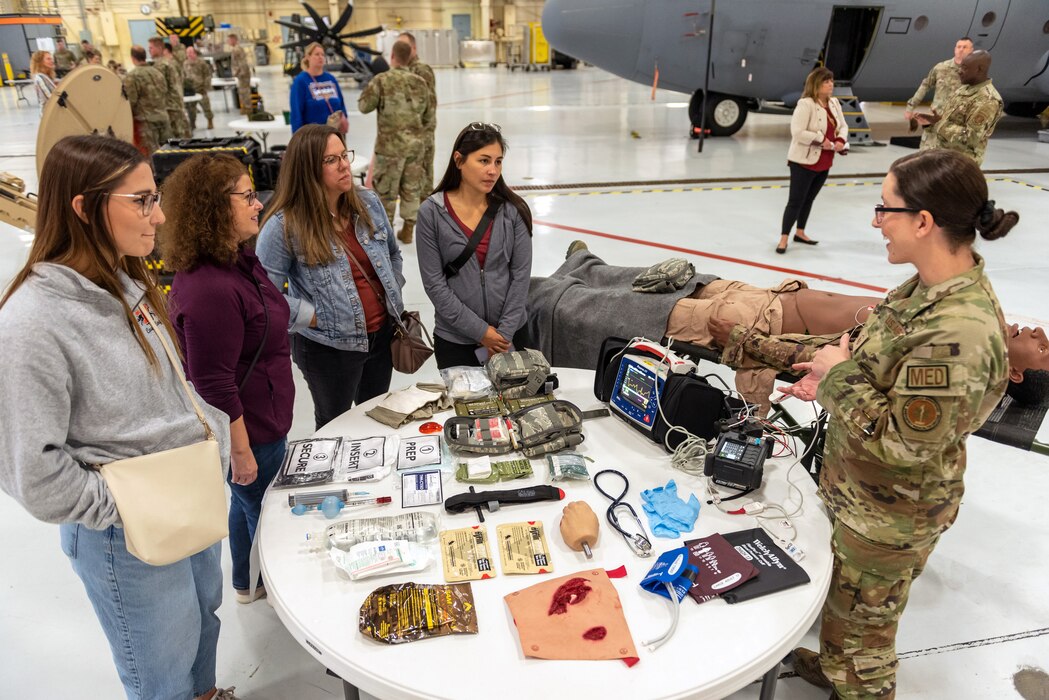 Civilians learn about military operations during a tour.