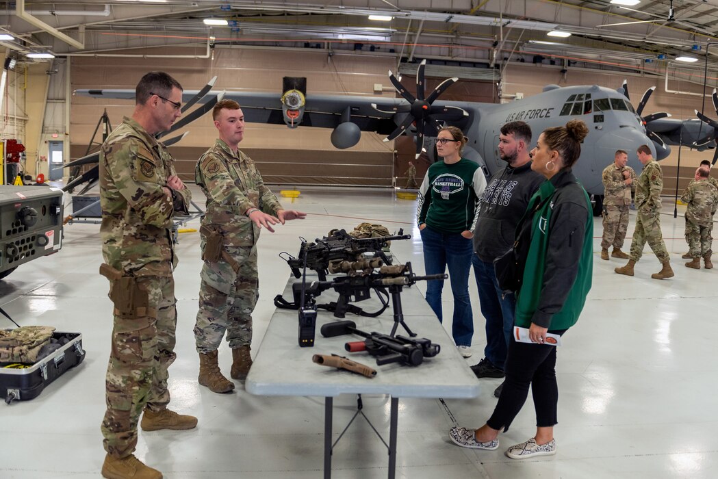 Civilians learn about military operations during a tour.
