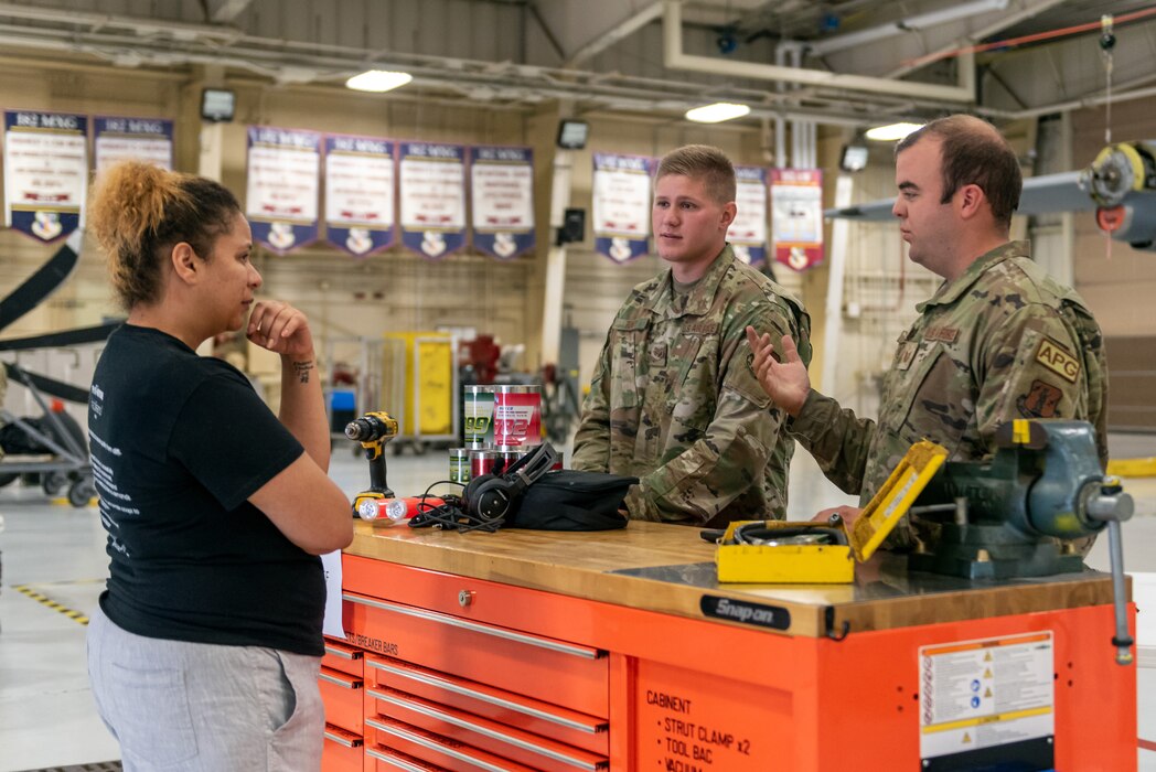 Civilians learn about military operations during a tour.