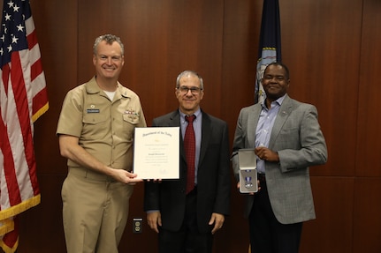 Retired Naval Surface Warfare Center, Philadelphia Division (NSWCPD) employee Joseph Borraccini was presented with the Department of the Navy Superior Civilian Service Award during NSWCPD’s Fiscal Year (FY) 2023 Third Quarter Awards Ceremony by NSWCPD Commanding Officer Capt. Joseph Darcy and Technical Director Nigel C. Thijs, SES, on Aug. 29, 2023. (U.S. Navy photo by Phillip Scaringi/Released)