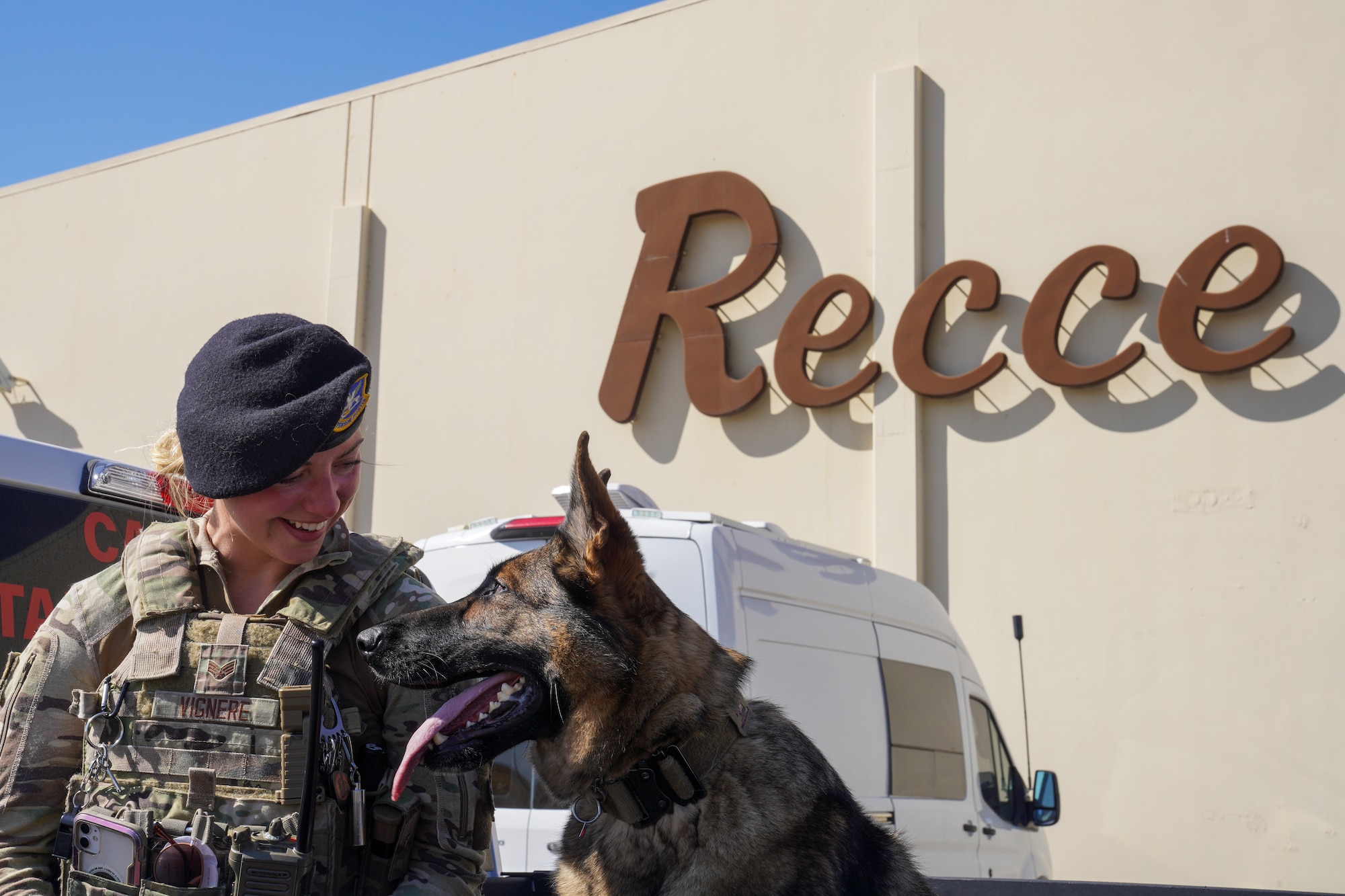 U.S. Air Force Senior Airman Kiersten Vignere, 9th Security Forces Squadron military working dog handler, and Sofi, 9th SFS military working dog, take a break after conducting explosive detection training, Sept. 14, 2023, at Beale Air Force Base, California.