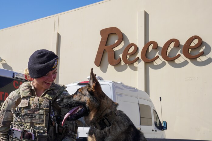 U.S. Air Force Senior Airman Kiersten Vignere, 9th Security Forces Squadron military working dog handler, and Sofi, 9th SFS military working dog, take a break after conducting explosive detection training, Sept. 14, 2023, at Beale Air Force Base, California.