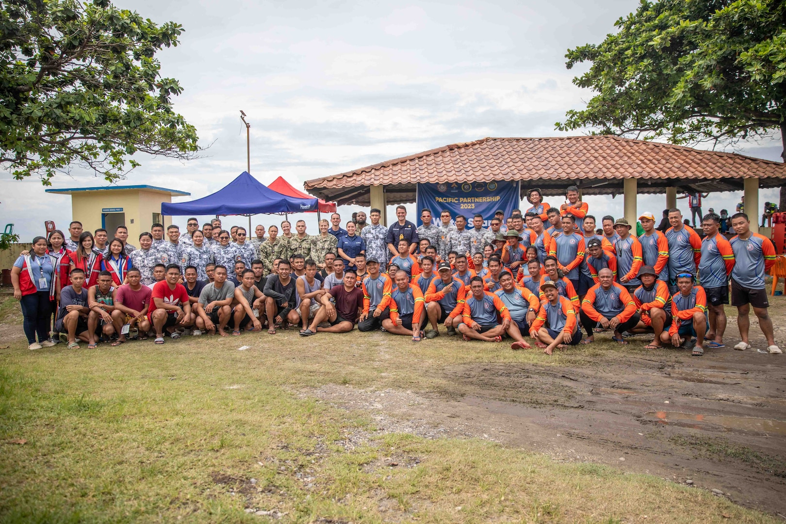 LA UNION, Philippines (Aug. 29, 2023) - Capt. Joseph Dransfield, Pacific Partnership 2023 Deputy Mission Commander, U.S. Navy, Filipino Coast Guard and Filipino Navy pose for a group photo after water search and rescue exercise at San Fernando Coast Guard Station, Aug 29. Now in its 18th year, Pacific Partnership is the largest annual multinational humanitarian assistance and disaster relief preparedness mission conducted in the Indo-Pacific. (U.S. Navy Photo by Mass Communication Specialist 2nd Class Megan Alexander)