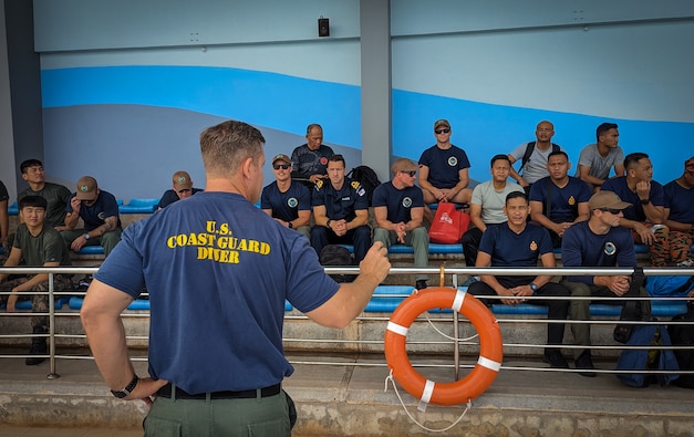 KUANTAN, Malaysia (Sept. 12, 2023) – Divers from U.S. Coast Guard, Royal Navy, Royal Malaysian Navy, Malaysian Coast Guard, Fire and Rescue Department of Malaysia and Republic of Korea listen to a safety brief during Pacific Partnership 2023, Sept. 12.  Now in its 18th year, Pacific Partnership is the largest annual multinational humanitarian assistance and disaster relief preparedness mission conducted in the Indo-Pacific. (U.S. Navy photo by Chief Mass Communication Specialist Eric Chan)