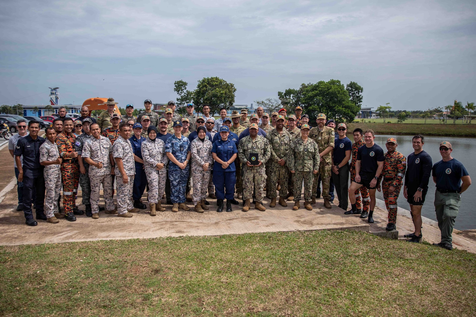 KUANTAN, Malaysia (Sept. 14, 2023) – U.S. Coast Guard, U.S. Navy, Royal Navy, Royal Malaysian Navy, Malaysian Coast Guard, Fire and Rescue Department of Malaysia, and Republic of Korea service members pose for a photo after a diving demonstaration at Akademi Maritim Sultan Ahmad Shah (AMSAS) in Kuantan, Malaysia, Sept. 14. Now in its 18th year, Pacific Partnership is the largest annual multinational humanitarian assistance and disaster relief preparedness mission conducted in the Indo-Pacific. (U.S. Navy photo by Mass Communication Specialist 2nd Class Megan Alexander)