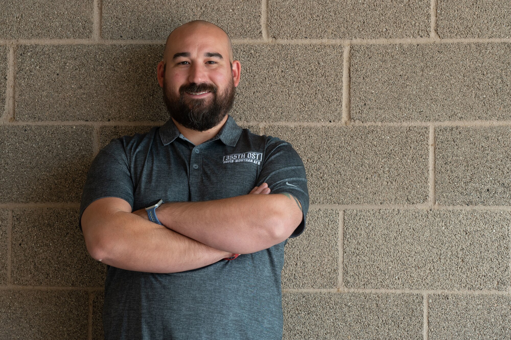 Adam Whittaker, The Operational Support Team strength and conditioning coach, poses for a photo at Davis-Monthan Air Force Base, Airz., Sept. 22, 2023. Whittaker worked with unit fitness program managers and physical training leaders to aid their physical training programs. (U.S. Air Force photo by Airman 1st Class Robert Allen Cooke III)