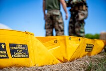 A U.S. Marine Corps chemical, biological, radiological, and nuclear (CBRN) defense specialist with Marine Wing Support Squadron 174 (MWSS-174), Marine Aircraft Group 24, 1st Marine Aircraft Wing, is decontaminated during a joint training exercise with MWSS-174 explosive ordnance disposal (EOD) technicians, Marine Corps Base Hawaii, Sept. 26, 2023. The exercise served to enhance the Marine’s response times and capabilities when called to a chemical, biological, radiological or nuclear incident. (U.S. Marine Corps photo by Lance Cpl. Hunter Jones)