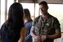 U.S. Marine Corps Col. Jeremy Beaven, commanding officer, Marine Corps Base Hawaii, speaks to Paloma Almanza, the principal of Mokapu Elementary School, during a Hawaii Department of Education Educators’ Reception, MCBH, Sept. 27, 2023. The purpose of the reception was to allow Hawaii public school principals and vice principals to discuss military-connected child education and the Adopt-A-School program with MCBH leadership. (U.S. Marine Corps photo by Cpl. Chandler Stacy)