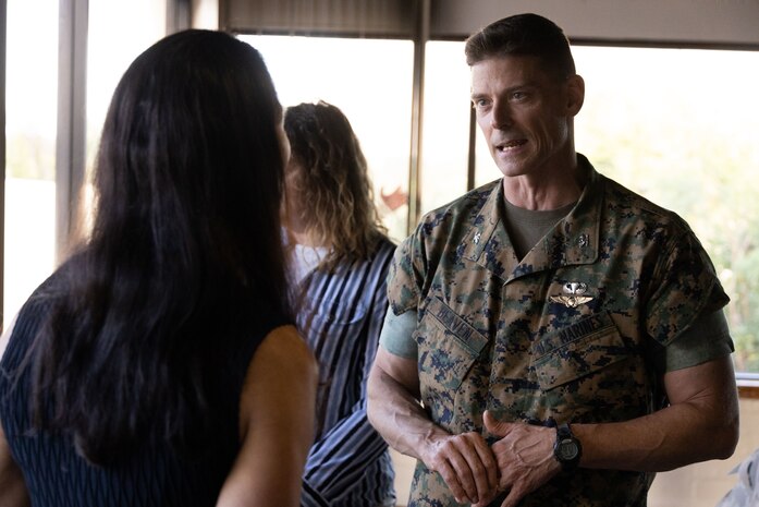 U.S. Marine Corps Col. Jeremy Beaven, commanding officer, Marine Corps Base Hawaii, speaks to Paloma Almanza, the principal of Mokapu Elementary School, during a Hawaii Department of Education Educators’ Reception, MCBH, Sept. 27, 2023. The purpose of the reception was to allow Hawaii public school principals and vice principals to discuss military-connected child education and the Adopt-A-School program with MCBH leadership. (U.S. Marine Corps photo by Cpl. Chandler Stacy)