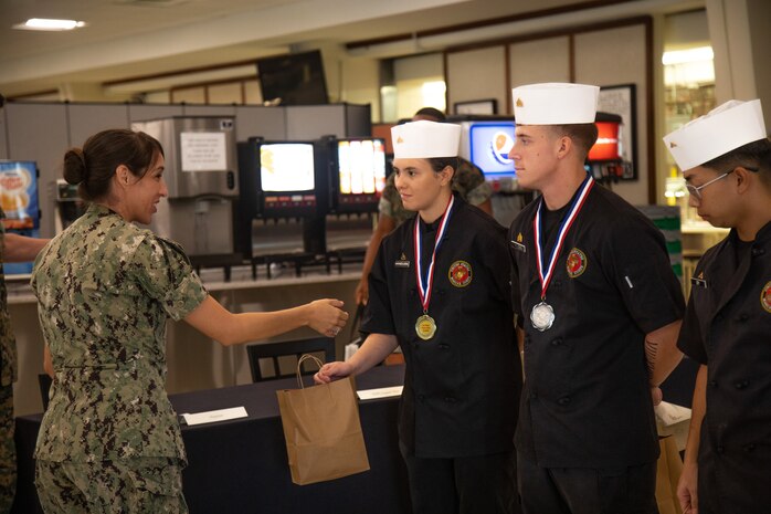 Gifts are awarded to winners of the Chef of the Quarter competition, Marine Corps Base Hawaii, Sept. 29, 2023. The competition provided an opportunity for food service specialists to hone their craft while fostering esprit de corps. (U.S. Marine Corps photo by Lance Cpl. Samuel Estridge)