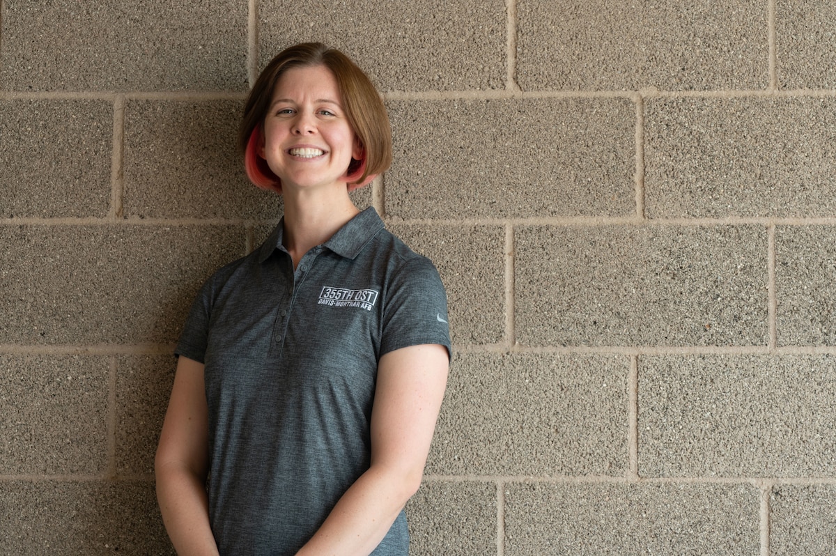 Megan DeHaven, Operational Support Team integrated specialist, poses for a photo at Davis-Monthan Air Force Base, Airz., Sept. 22, 2023. DeHaven analyzed and aggregated data to promote the team’s efforts. (U.S. Air Force photo by Airman 1st Class Robert Allen Cooke III)