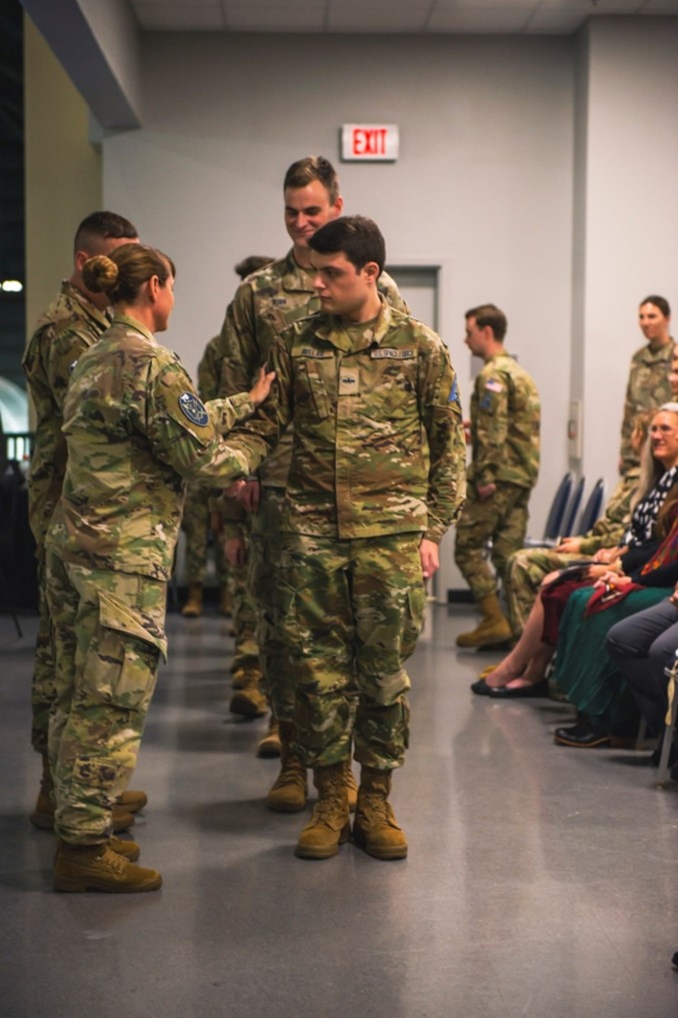 Military members shaking hands.