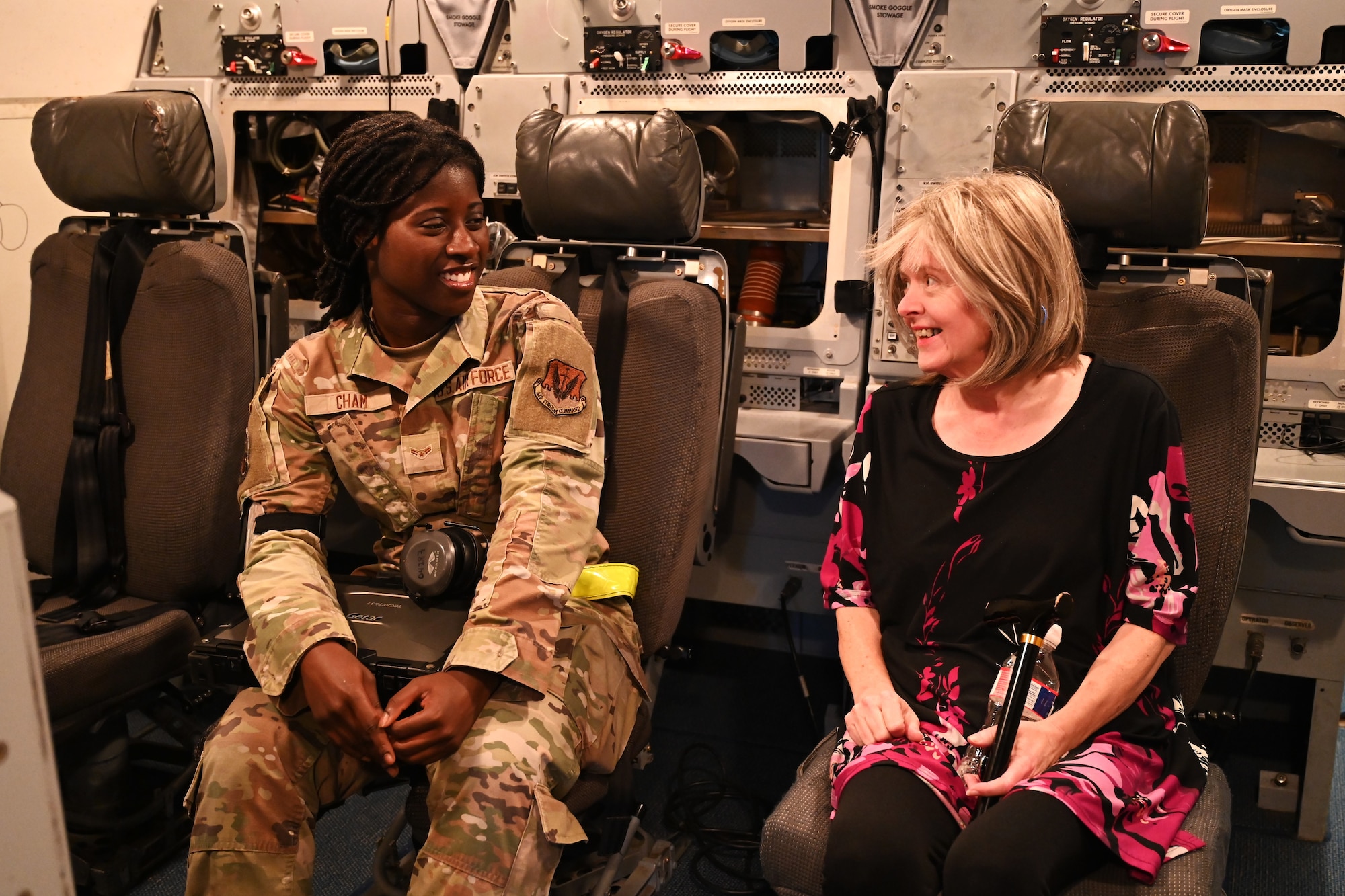 airmen talking to woman