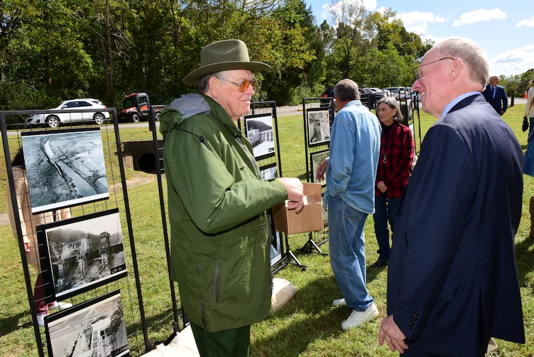 Rep. John Rose (Right), Tennessee 6th District, chats with Retired Park Ranger R. Gerald Lee during the Cordell Hull Dam 50th Anniversary Celebration Oct. 7, 2023, on the shoreline below the dam in Elmwood, Tennessee. Lee served arrived at Cordell Hull Lake in August 1971 to serve as the first park ranger for the project. (USACE Photo by Lee Roberts)