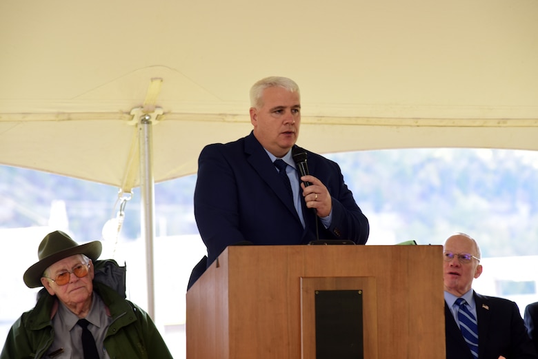 Kenny Claywell, Cordell Hull Lake Natural Resource manager, speaks about sacrifices made by farmers and property owners in the late 1950s and early 1960s to make way for Cordell Hull Dam and Lake while addressing guests during the Cordell Hull Dam 50th Anniversary Celebration Oct. 7, 2023, on the shoreline below the dam in Elmwood, Tennessee. (USACE Photo by Lee Roberts)