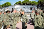 Cmdr. Daniel Schmitt, left, commaning officer of Naval Mobile Construction Battalion 1 (NMCB 1), and Cmdr. Christopher Archer, commanding officer of Naval Mobile Construction Battalion 133, turn over command of Camp Mitchell in Rota, Spain, September 1, 2023.