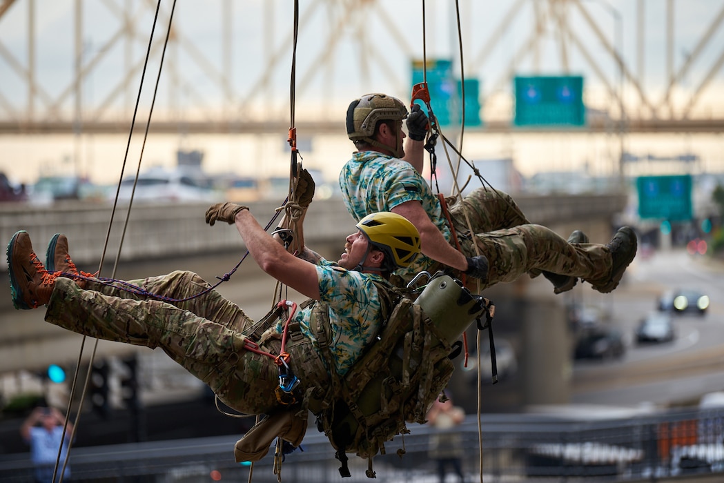 U.S. Air Force pararescuemen execute an urban high-angle ropes scenario to reach a simulated injured service member, render medical care, and lower him to safety during the PJ Rodeo competition in Louisville, Ky., Sept. 6, 2023. The biennial event, which tests the capabilities of pararescue Airmen across the service, was hosted by the Kentucky Air National Guard’s 123rd Special Tactics Squadron. (U.S. Air National Guard photo by Phil Speck)