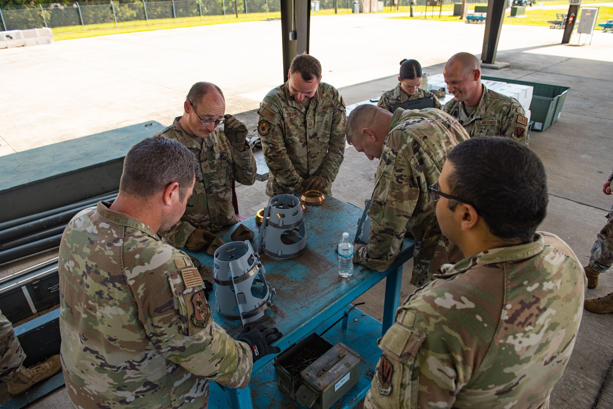 U.S. Air Force Airmen inspect BDU-50 equipment during a wing leadership visit at Moody Air Force Base, Georgia, Oct. 2, 2023. Before assembly Airmen are to carefully inspect equipment to reduce chances of assembly failure. (U.S. Air Force Airman 1st Class Sir Wyrick)