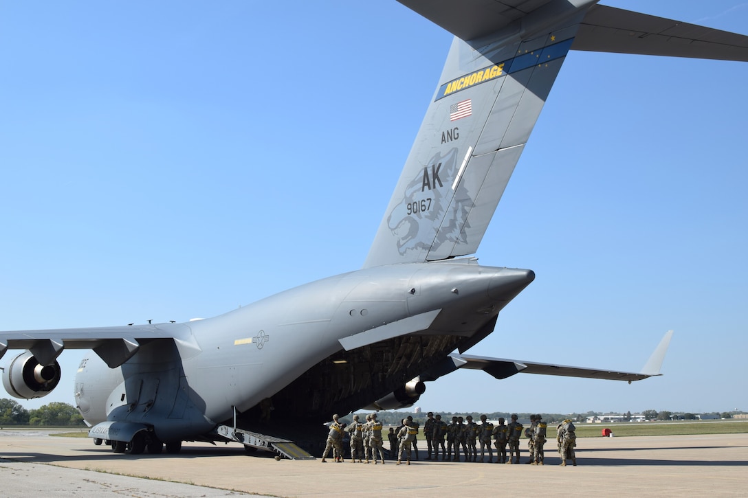 Nebraska Army National Guard soldiers board a C-17 Globemaster III in preparation for a static line jump Sept. 29, 2023, in Lincoln, Neb.
