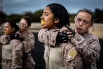 U.S. Marine Corps Recruit Alexa Wise with Fox Company, 2nd Recruit Training Battalion, demonstrates a rear choke on recruit Jasmine Medina, during a Marine Corps Martial Arts Program course at Marine Corps Recruit Depot San Diego, Oct. 10, 2023. MCMAP aims to strengthen the mental and moral resiliency of individual Marines through realistic combative training, warrior ethos studies, and physical hardening. Wise was recruited out of Sapulpa, Okla. Medina was recruited out of Waco, Texas. (U.S. Marine Corps photo by Sgt. Jesse K. Carter-Powell)