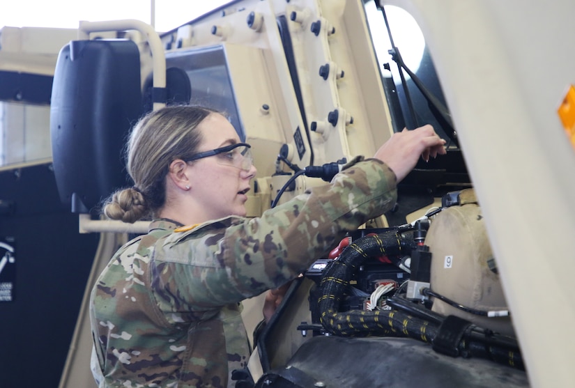 Spc. Shaila Campbell performs maintenance on the four seat Combat Tactical Joint Light Tactical Vehicle. 94th Training Division award winning Regional Training Site Maintenance Fort Indiantown Gap (RTSM-FIG), graduated its latest Wheeled Vehicle Mechanics reclass course.