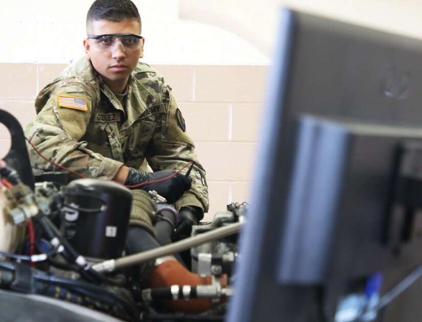 Spc. John Gonzalez Santiago applies what he learned in the classroom during the hands-on portion of the wheeled vehicle mechanic (91B) reclass course. 94th Training Division award winning Regional Training Site Maintenance Fort Indiantown Gap (RTSM-FIG), graduated its latest Wheeled Vehicle Mechanics reclass course.