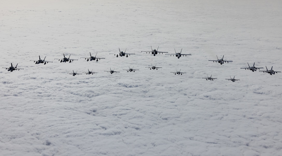 U.S. Marines with Marine Fighter Attack Training Squadron (VMFAT) 101, Marine Aircraft Group 11, 3rd Marine Aircraft Wing, conduct a mass formation launch known as “flying the barn,” to honor the squadron’s legacy on the day of its deactivation at Marine Corps Air Station Miramar, California, Sept. 29, 2023. For more than 50 years, instructor pilots of the VMFAT-101 “SharpShooters” have qualified combat aviators and sent them to operational squadrons worldwide. (U.S. Marine Corps photo by Lance Cpl. Samantha Devine)