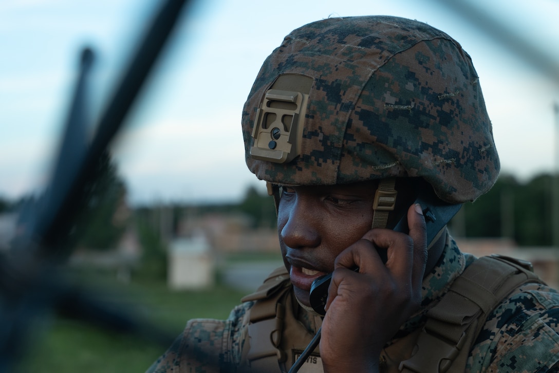 U.S. Marine Cpl. Kentrell Davis, an aviation communication systems technician with Marine Air Support Squadron, 4th Marine Aircraft Wing, establishes radio communication during Northern Lightning 23 at Fort McCoy, Wisconsin, Aug. 16, 2023. Northern Lightning is one of the seven Air National Guard joint accredited readiness exercises that increases military readiness by providing participating units a tactical, joint training environment to execute realistic combat training. Davis is a native of Duarte, California. (U.S. Marine Corps photo by Cpl. Ujian Gosun)