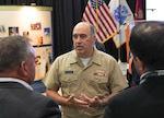 IMAGE: Naval Surface Warfare Center Dahlgren Division Commanding Officer Capt. Philip Mlynarski engages with attendees, discussing ways to enhance the future of the Navy warfighter during the Naval Surface Technology & Innovation Consortium Other Transaction Authority Collaboration Event, Oct. 4