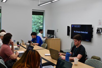 IMAGE: Naval Surface Warfare Center Dahlgren Division scientists and engineers at the beginning of their careers worked together in groups to develop presentations at the New Employee Development Assignment Innovation Challenge at University of Mary Washington Dahlgren Campus Oct. 2-6.