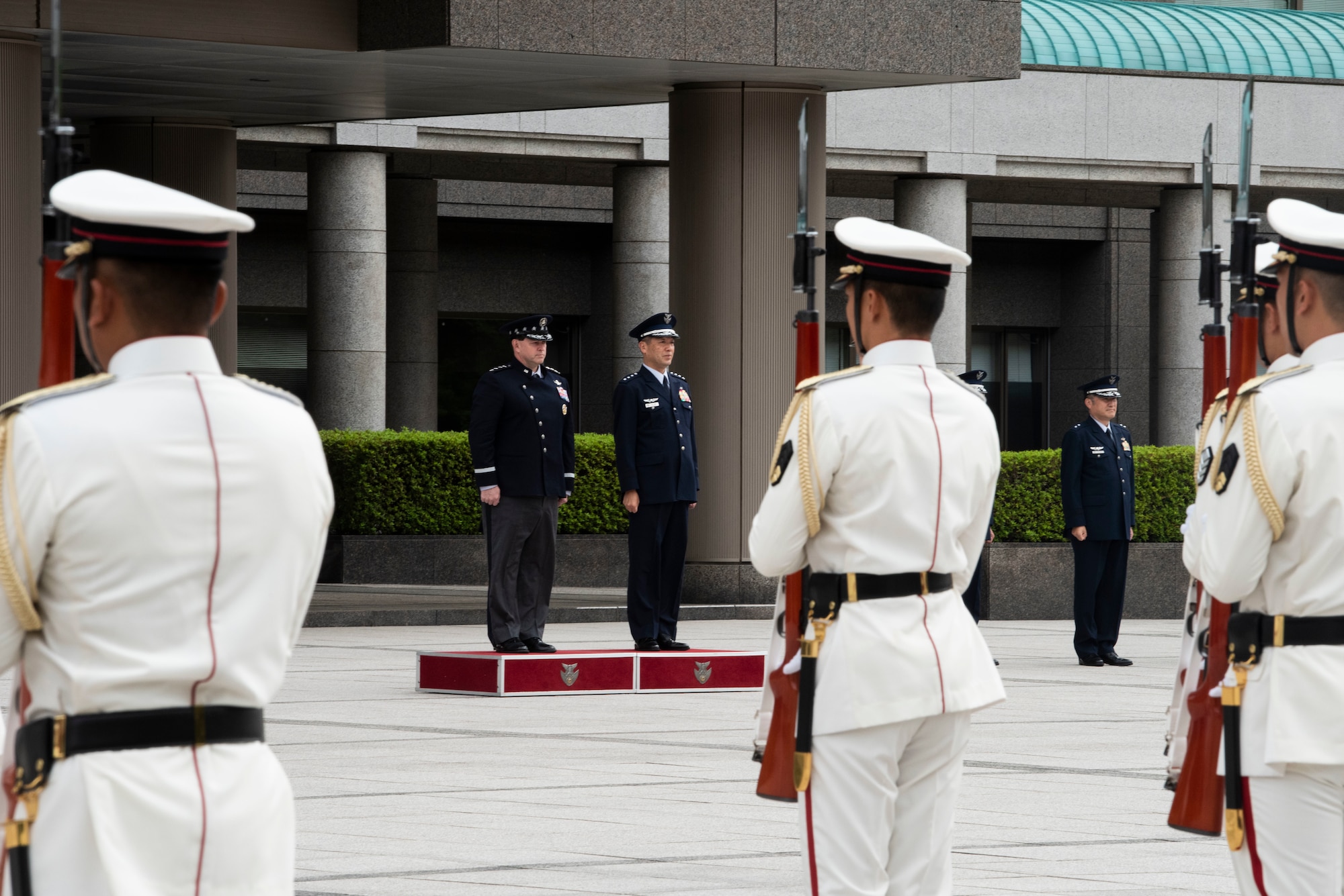 People standing in formation during a ceremony.