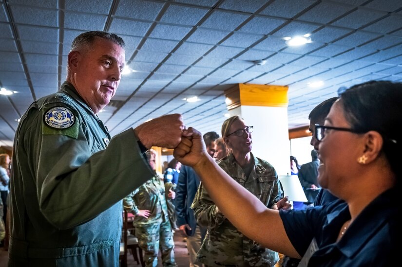 U.S. Air Force Gen. Mike Minihan, Air Mobility Command commander, greets Airman 1st Class Marian, 305th Aerial Port Squadron air transportation specialist, during the Sean’s Room opening at Joint Base McGuire-Dix-Lakehurst, N.J. on 10 October, 2023. Modeled after Sean’s House, a program based in Newark, Delaware, Sean’s Room offers a safe peer-to-peer environment for JB MDL personnel to receive mental health support and maintain confidentiality as required by law. Sean’s House was originally founded by Christopher Locke after he tragically lost his son, Sean, to suicide in 2018.