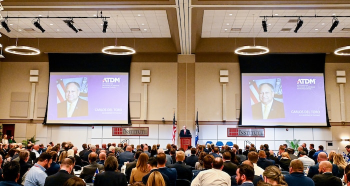 SECNAV) Carlos Del Toro delivers remarks at the third annual Accelerated Training in Defense Manufacturing (ATDM) and Navy Additive Manufacturing Center of Excellence (AM COE) Summit in Danville, Virginia.