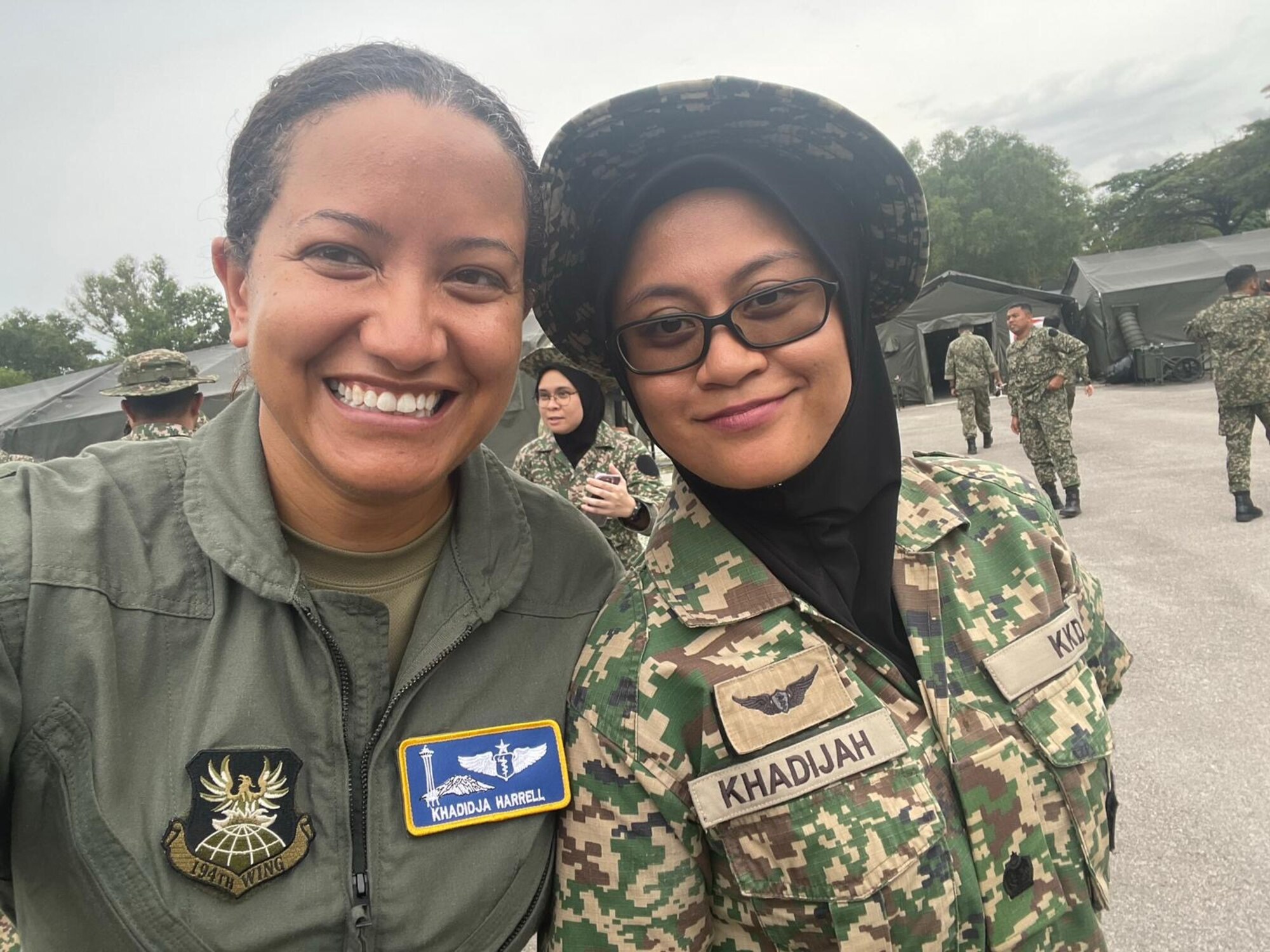 Lt. Col. Khadidja Harrell, a flight surgeon with the 194th Medical Group, poses for a photo with her Malaysian counterpart during the Indo-Pacific Military Health Exchange Sept. 26-29, 2023, in Kuala Lumpur, Malaysia. The multilateral military event focused on global health interoperability.