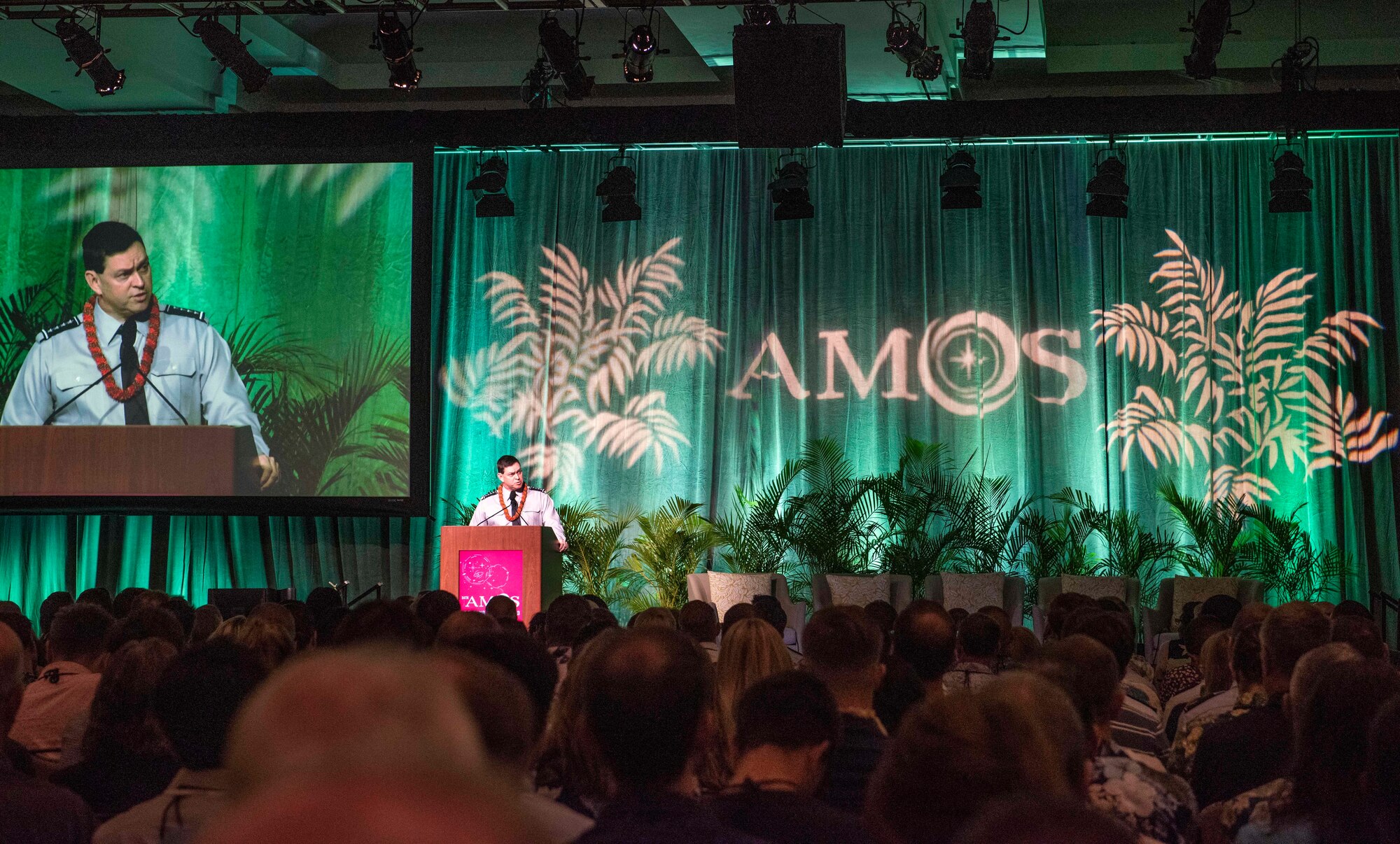 A person standing at a podium speaking.