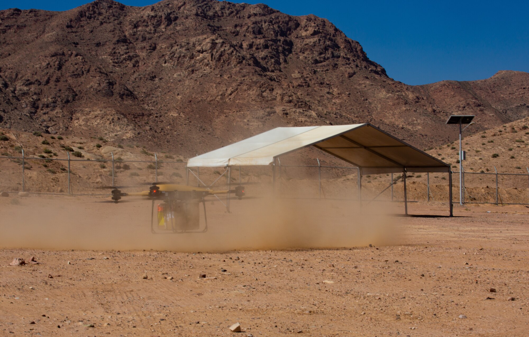 A Tactical Resupply Vehicle 150 flies carrying cargo